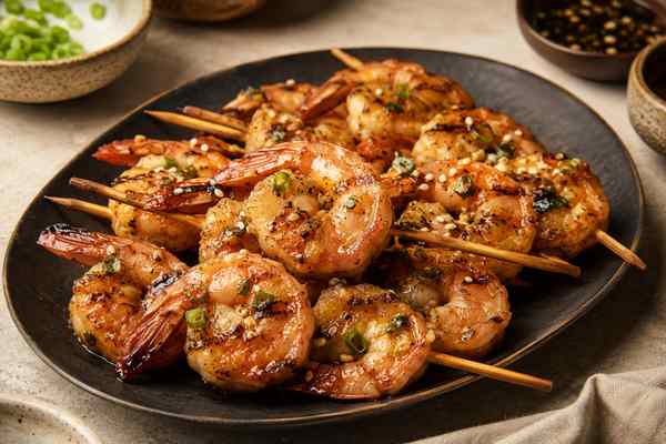 Finished Soy-Garlic Grilled Shrimp presented in a warm Korean dining setting.