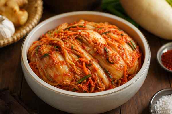 Finished Baechu Kimchi presented in a warm Korean dining setting.